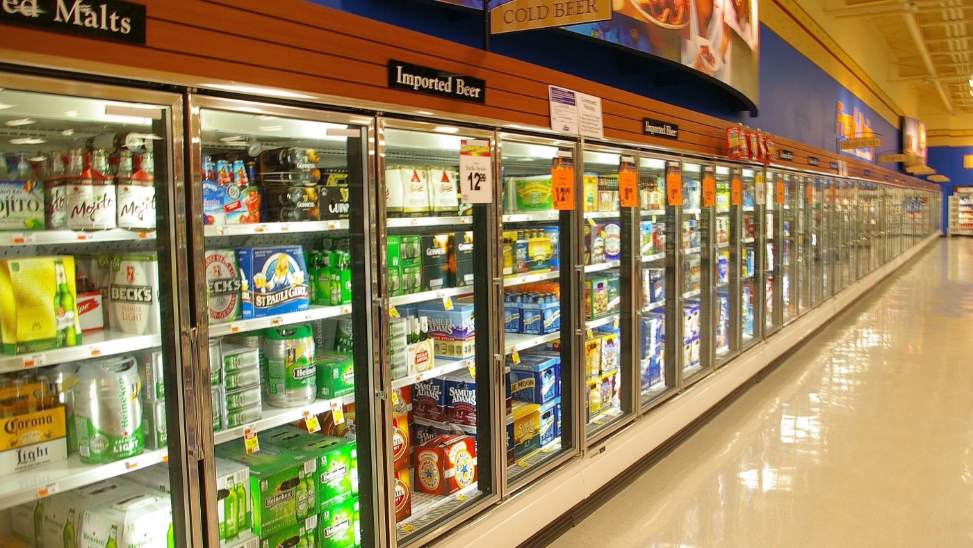 The refrigerated beer aisle of an American supermarket